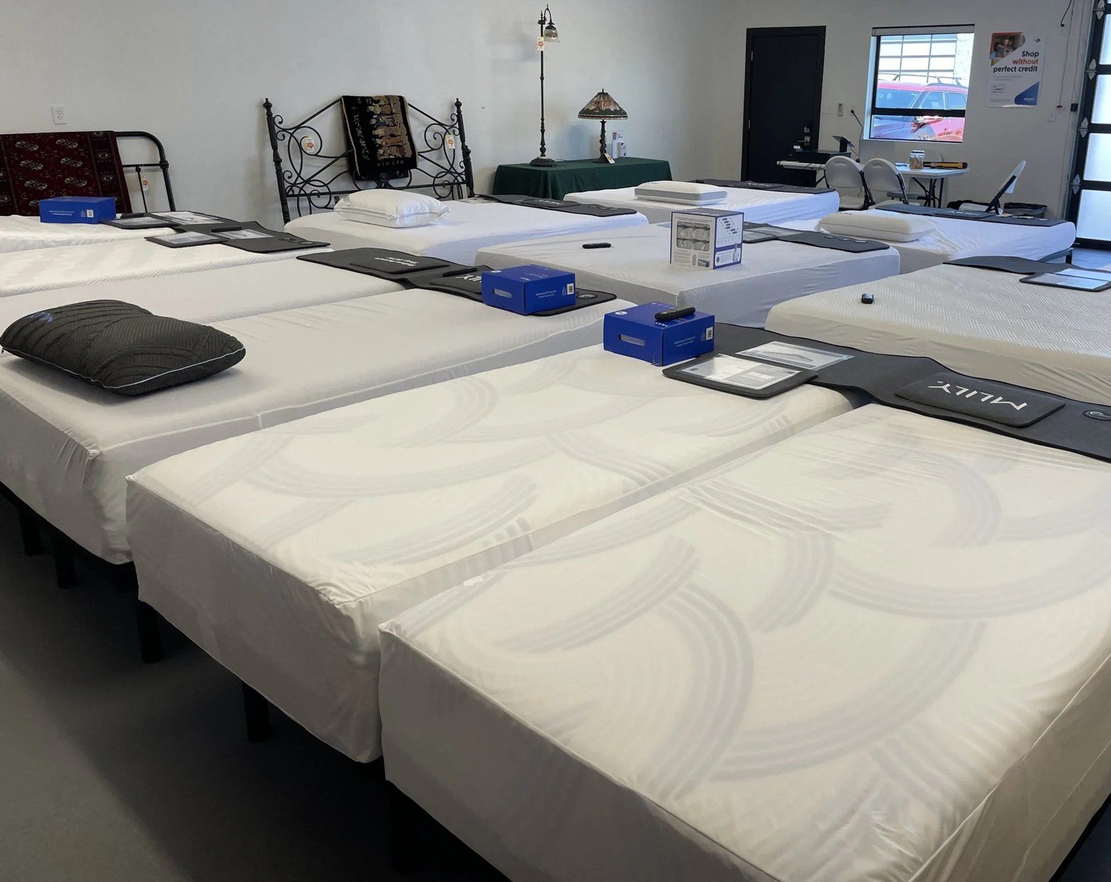 MLily mattresses lined up on the showroom floor at Route 66 Sleep & Home Center