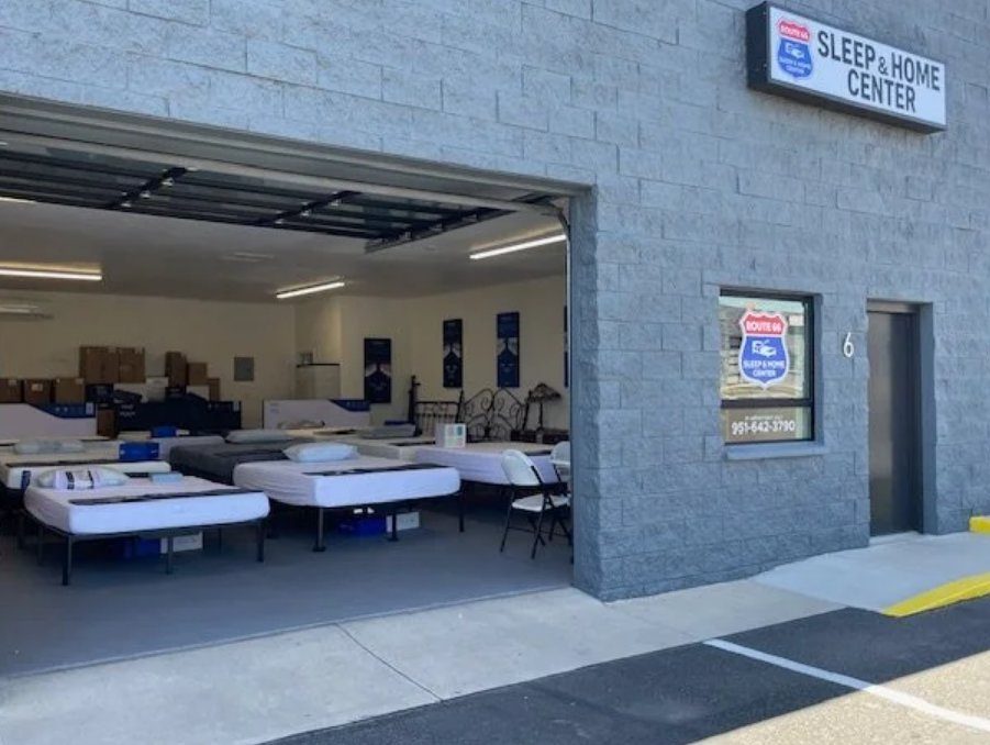 The Route 66 Sleep & Home Center storefront on Stockton Hill Road, Kingman — Unit 6 with black roll-up door